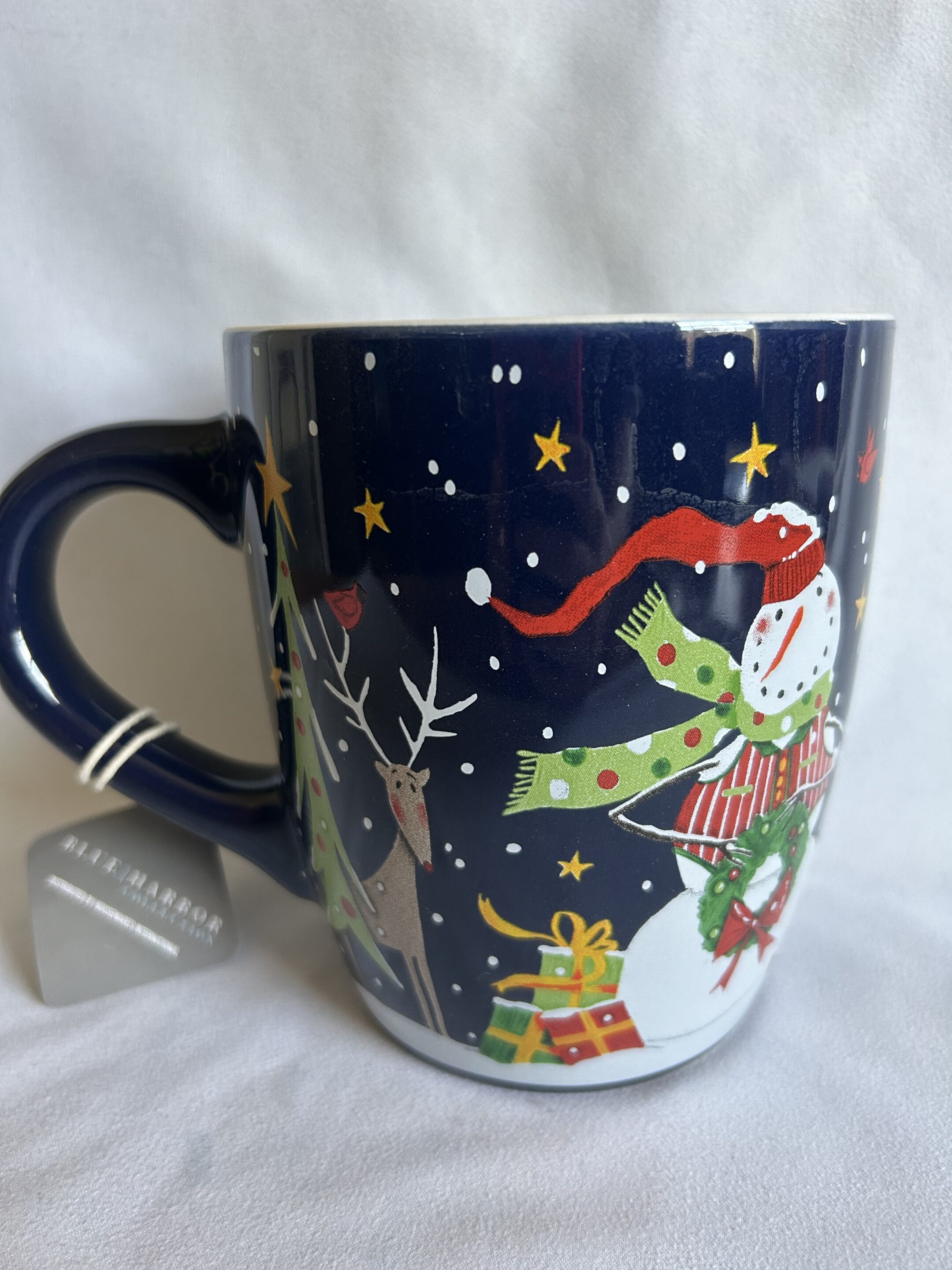 25oz Blue Snowman Holding Wreath Mug
